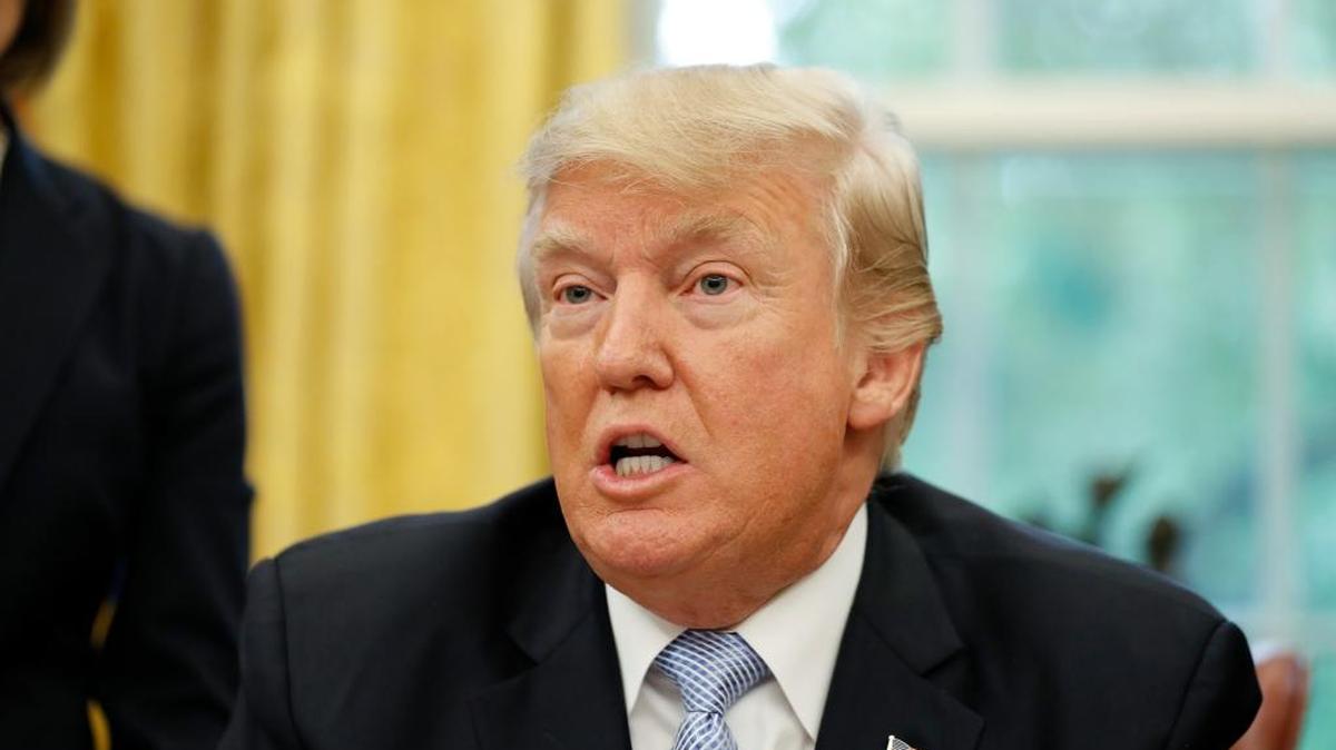 President Donald Trump speaks about Harvey in the Oval Office of the White House, Friday, Sept. 1, 2017, in Washington.