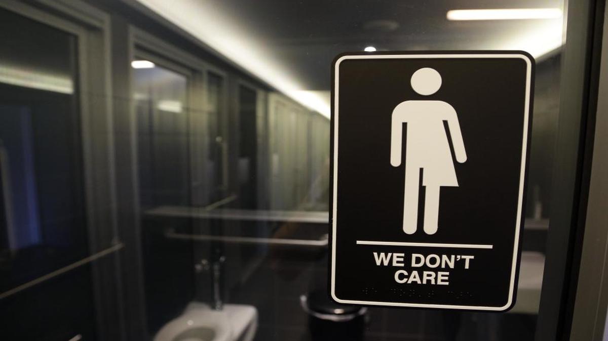 This Thursday, May 12, 2016, file photo, shows a sign outside a restroom at 21c Museum Hotel in Durham, N.C.