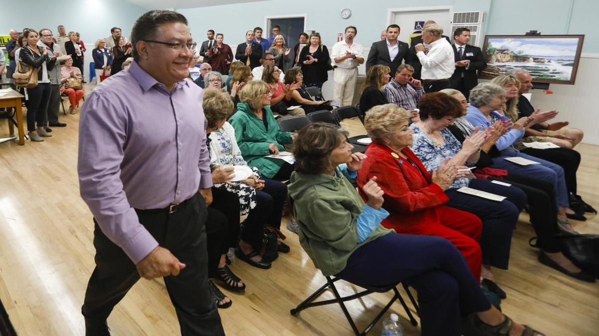 Salud Carbajal walks up to the stage to speak at a candidate meet-and-greet at the Shell Beach Veterans Hall.