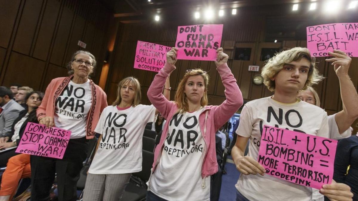 Members of the activist group CodePink gather for a Senate Armed Services Committee hearing in 2014.