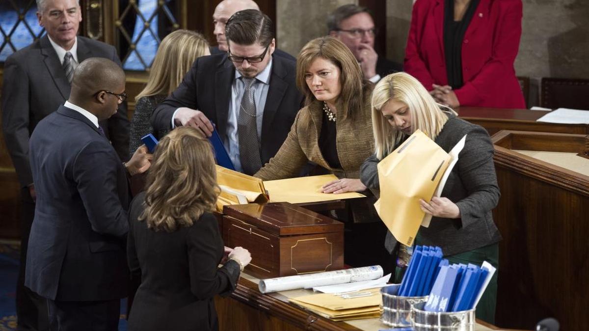 Congressional staff prepare the Electoral College ballots to be certified during a joint session of Congress to count the electoral ballots, on Capitol Hill in Washington, Friday, Jan. 6, 2017.