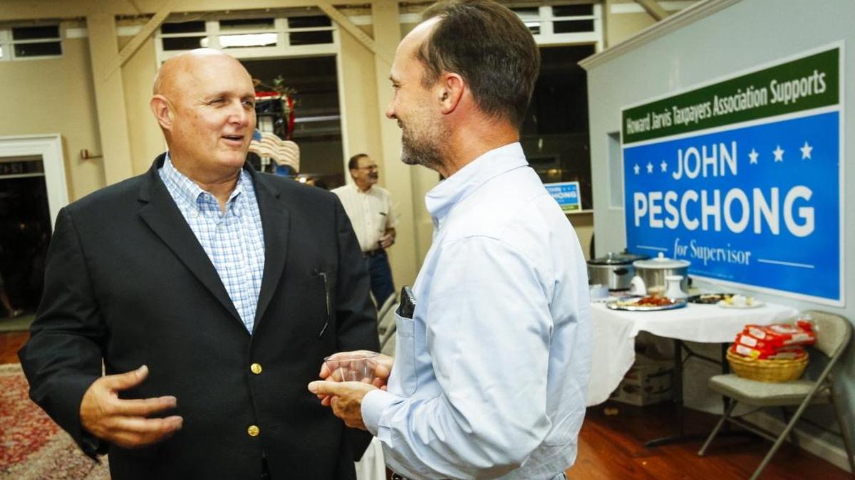 John Peschong, left, talks with a supporter at Peschong’s election night party in Paso Robles.