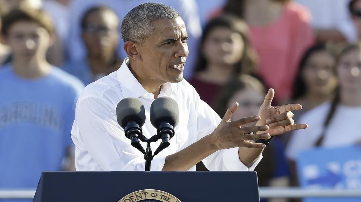 President Barack Obama speaks to supporters while campaigning for Democratic presidential candidate Hillary Clinton in Chapel Hill, N.C., on Wednesday.