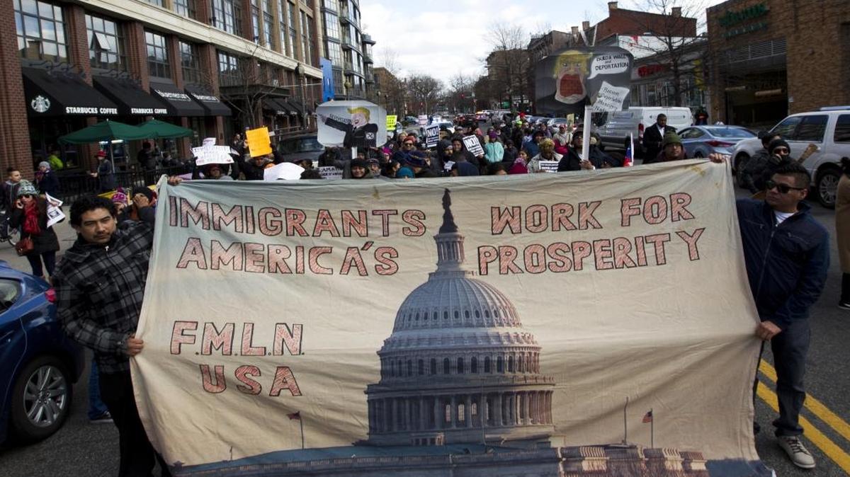 Supporters of immigrants' rights march downtown Washington, D.C., during an immigration protest Thursday, Feb. 16, 2017. Immigrants around the U.S. stayed home from work and school Thursday to demonstrate how important they are to America's economy and its way of life, and many businesses closed in solidarity, in a nationwide protest called A Day Without Immigrants.