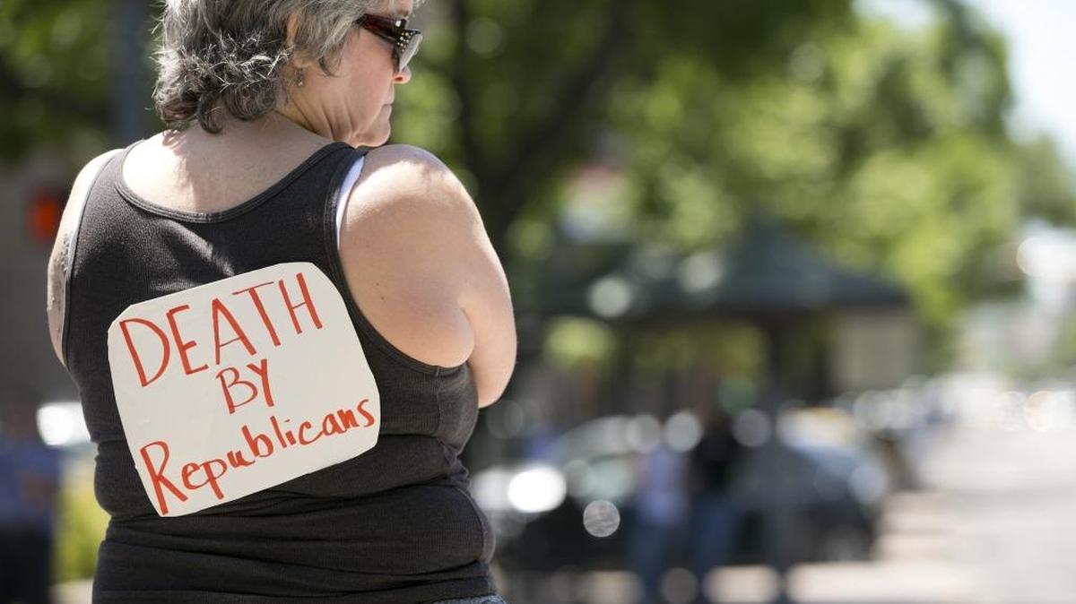Linda Miller protests the U.S. House passage of the plan to repeal and replace the Affordable Care Act at the south gate of the Capitol in Austin, Texas, on Friday May 5, 2017.