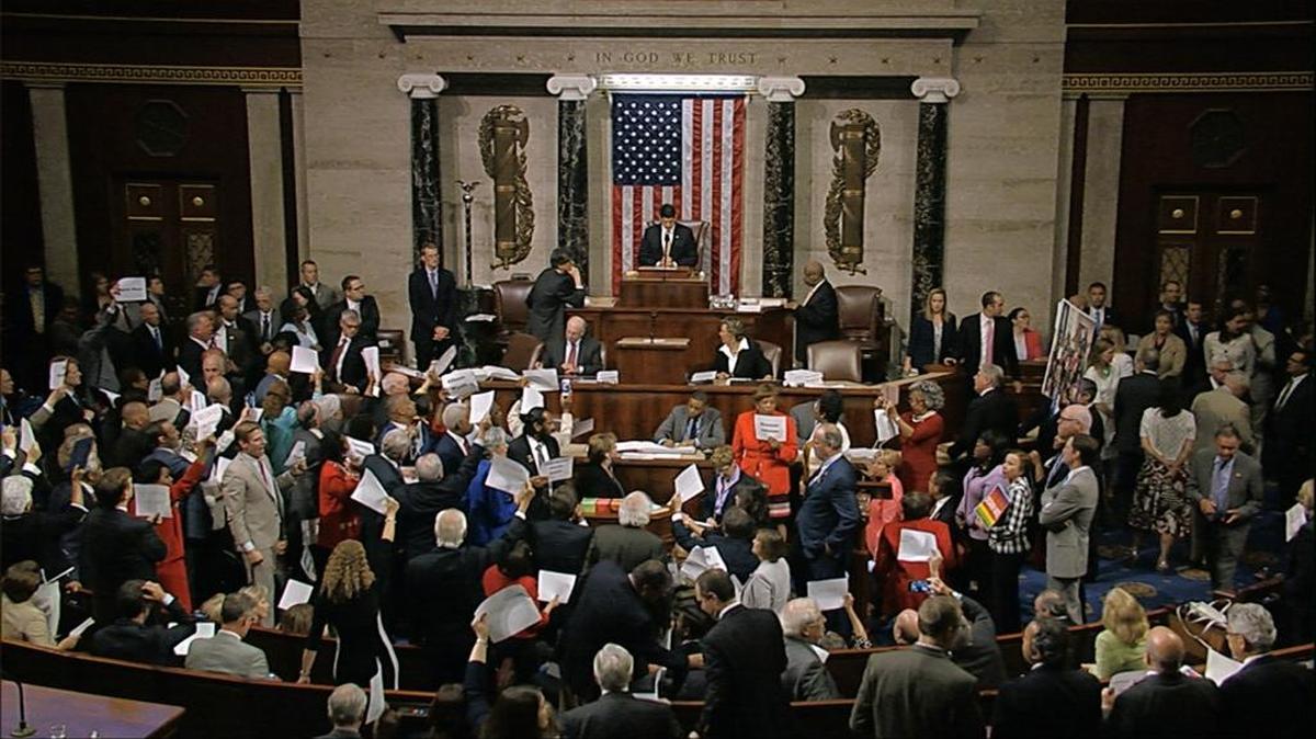 In this image from video provided by House Television, House Speaker Paul Ryan stands at the podium as he brings the House into session June 22, 2016, in Washington. Rebellious Democrats staged an extraordinary all-day sit-in on the House floor to demand votes on gun-control bills, shouting down Ryan when he attempted to restore order as their protest stretched into the night. The sit-in was well into its 10th hour, with Democrats camped out on the floor stopping legislative business in the House, when Ryan stepped to the podium to gavel the House into session and hold votes on routine business. Angry Democrats chanted “No bill, no break!” and waved pieces of paper with the names of gun victims, continuing their protest in the well of the House even as the House voted on a previously scheduled and unrelated measure to overturn an Obama veto