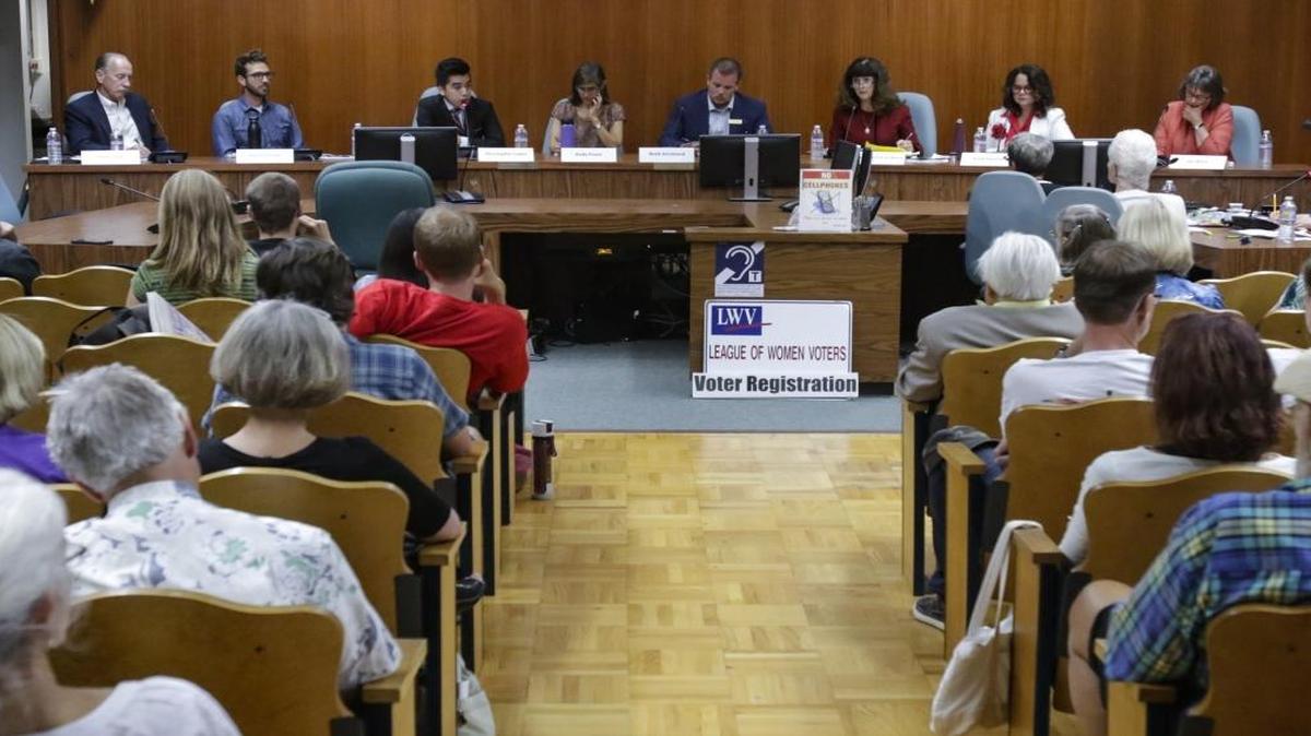 From the left: Michael Clark, Aaron Gomez, Christopher Lopez, Andy Pease, Brett Strickland and Mila Vujovich-La Barre, Heidi Harmon, Jan Marx. SLO’s City Council and mayor candidates met for a forum held by the League of Women Voters.