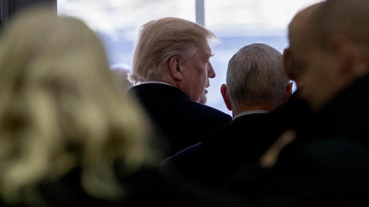 President Donald Trump, accompanied by Republican congressmen and members of his cabinet, departs after speaking at a news conference following a Congressional Republican Leadership Retreat at Camp David, Md., Saturday, Jan. 6, 2018.