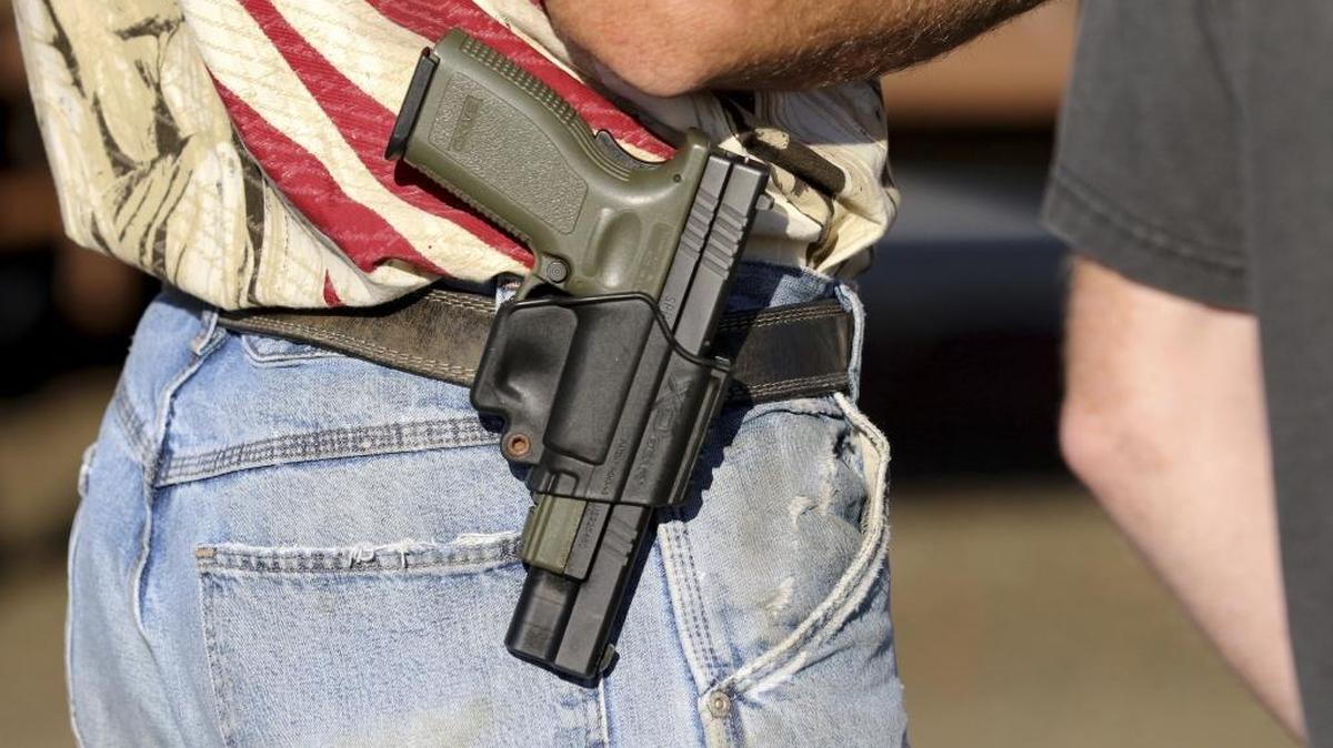 In this Oct. 9, 2015 photo, a man wears a firearm in Roseburg, Ore.