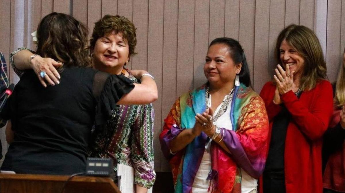 Mayor Heidi Harmon hugs Mona Olivas Tucker, chair of the Northern Chumash Tribe, as Clairibel Terril and Wendy Lucas applaud on Tuesday as the City Council proclaimed San Luis Obispo would celebrate Indigenous Peoples Day in place of Columbus Day.