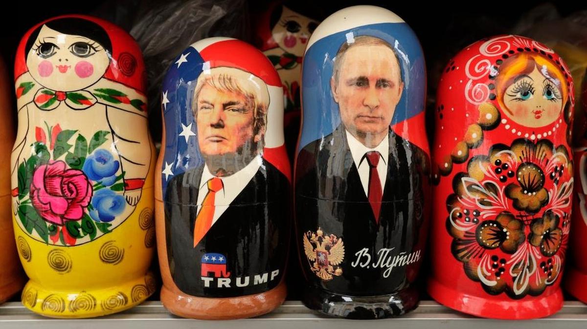 Traditional Russian wooden dolls called Matryoshka depicting U.S. President Donald Trump, centre left and Russian President Vladimir Putin are displayed for sale at a souvenir street shop in St. Petersburg, Russia.