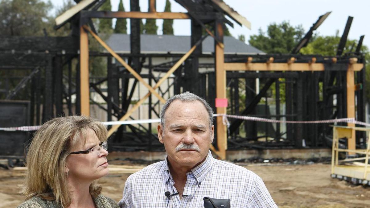 Donna and Greg France, farmers and project owners at the scene of Nipomo housing under construction intended for farmworkers. One house destroyed by a fire while another was damaged.