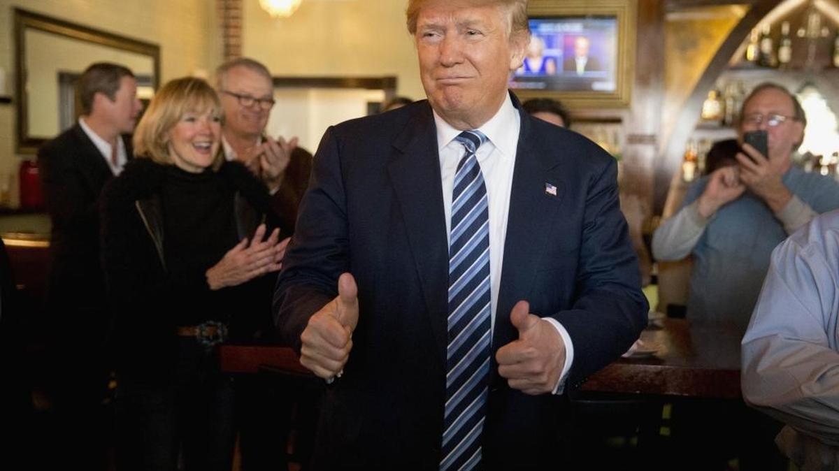 Republican presidential candidate Donald Trump gestures during a lunch stop, Thursday, Feb. 18, 2016, in North Charleston, S.C.