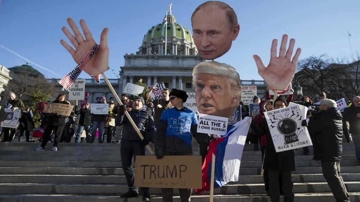 In this Dec. 19, 2016 file photo, protesters demonstrate ahead of Pennsylvania's 58th Electoral College at the state Capitol in Harrisburg, Pa.