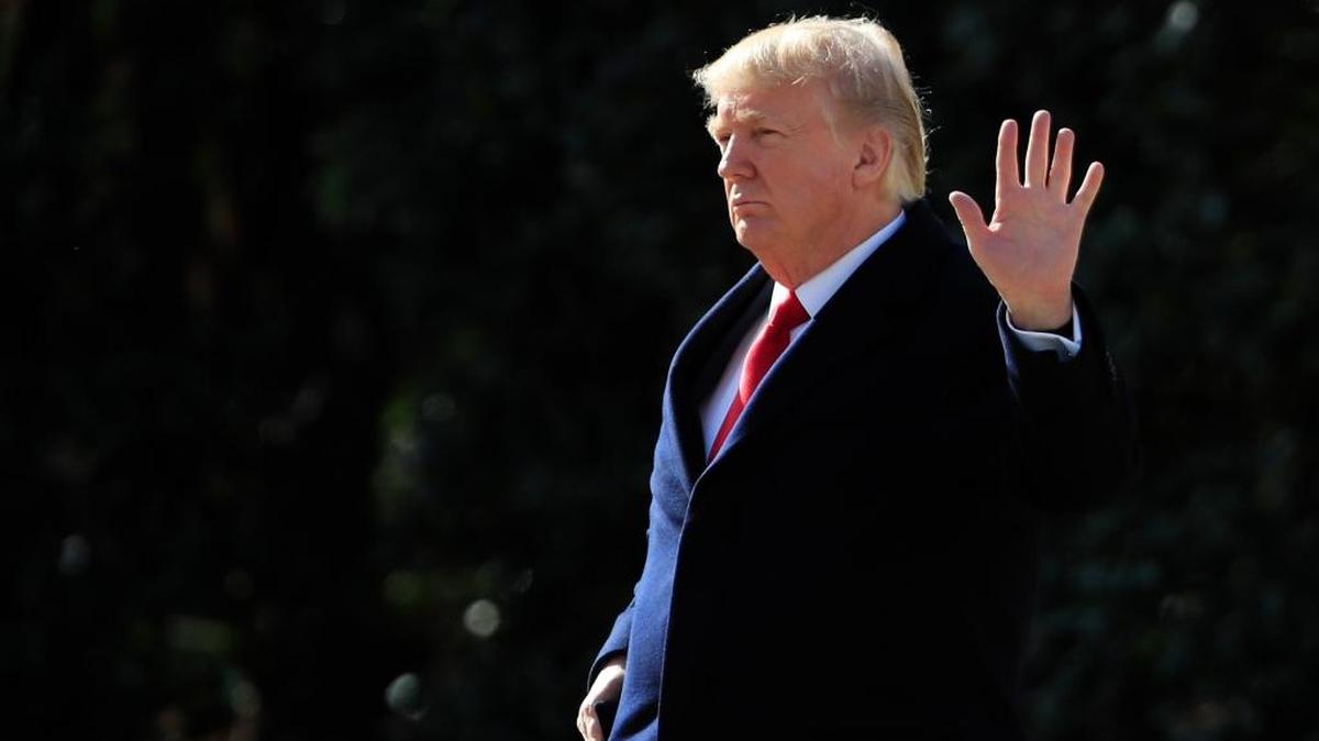 President Donald Trump waves as he leaves the White House in Washington, Friday, Feb. 2, 2018, en route to the Customs and Border Protection National Targeting Center in Sterling, Va.