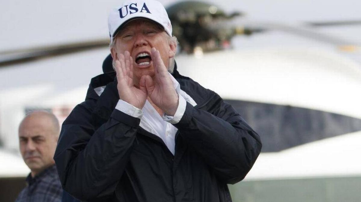 President Donald Trump responds to a reporters question as he boards Air Force One with first lady Melania Trump, not shown, for a trip to Florida to meet with first responders and people impacted by Hurricane Irma, Thursday, Sept. 14, 2017, in Andrews Air Force Base, Md.