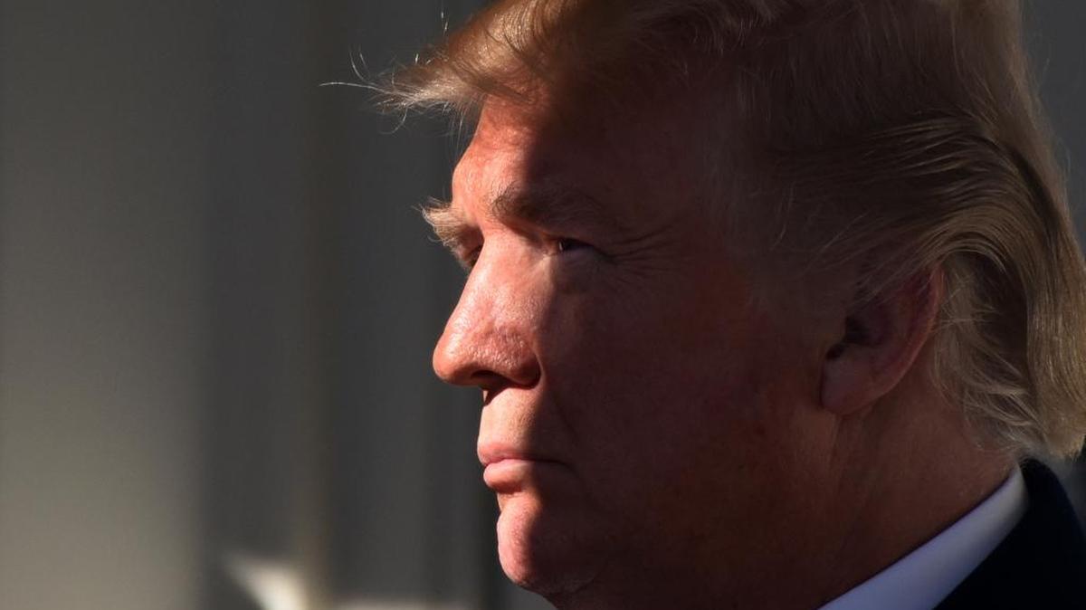 U.S. President Donald Trump listens to Vice President Mike Pence before addressing March for Life Participants and Pro-Life Leaders in the Rose Garden of the White House Jan. 19, 2018 in Washington, D.C.