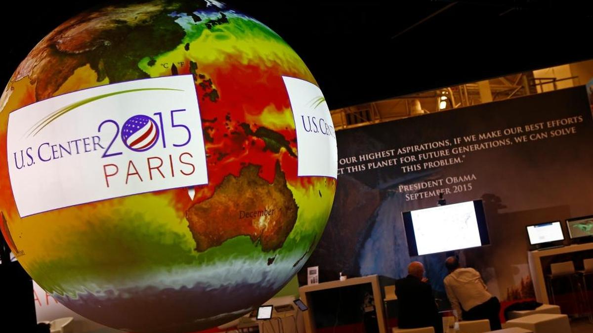 A giant globe displays a video animation during a conference about Antarctic mass change at the U.S. Pavillon during the U.N. Climate Change Conference in Le Bourget, outside Paris, on Dec. 1, 2015.