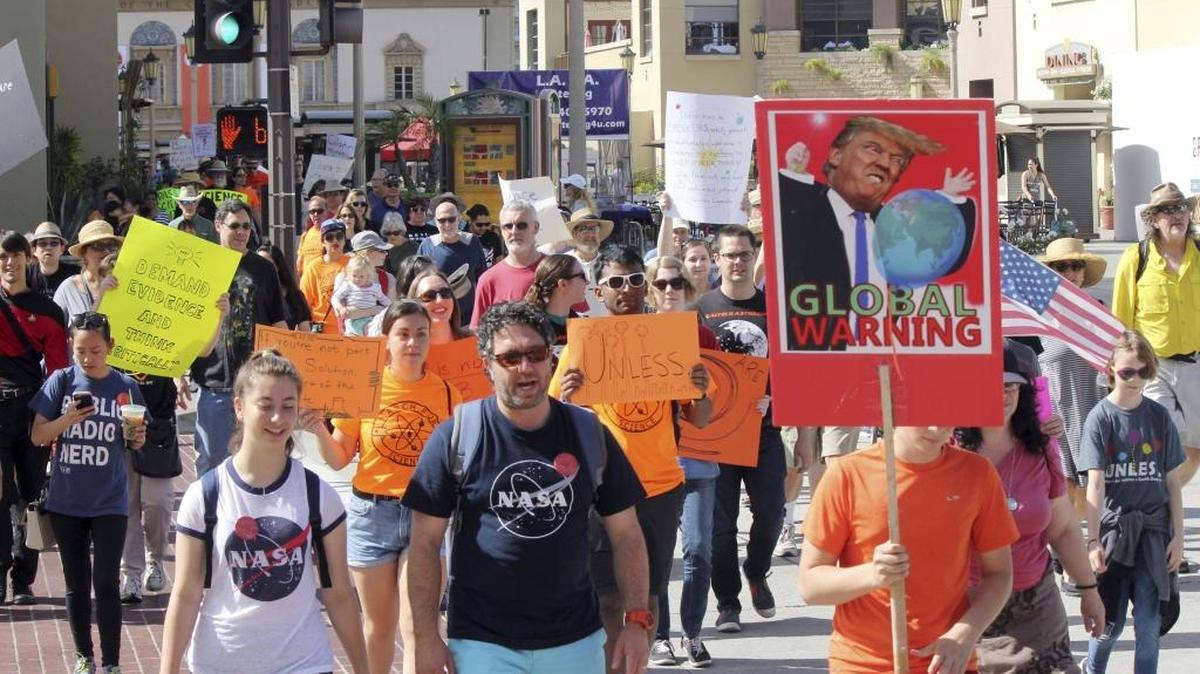 Demonstrators in support of the March for Science walk in Pasadena, Calif., Saturday, April 22, 2017.