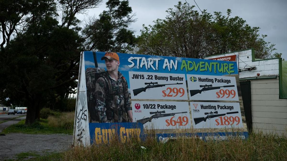 A sign advertising guns on sale in the outskirts of Christchurch, New Zealand, March 16, 2019.