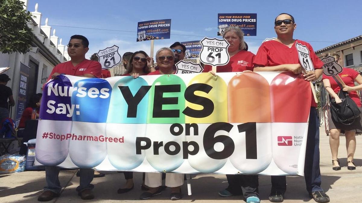 In this Sept. 19, 2016 photo, backers of the Yes on Proposition 61 measure rally in downtown Los Angeles.