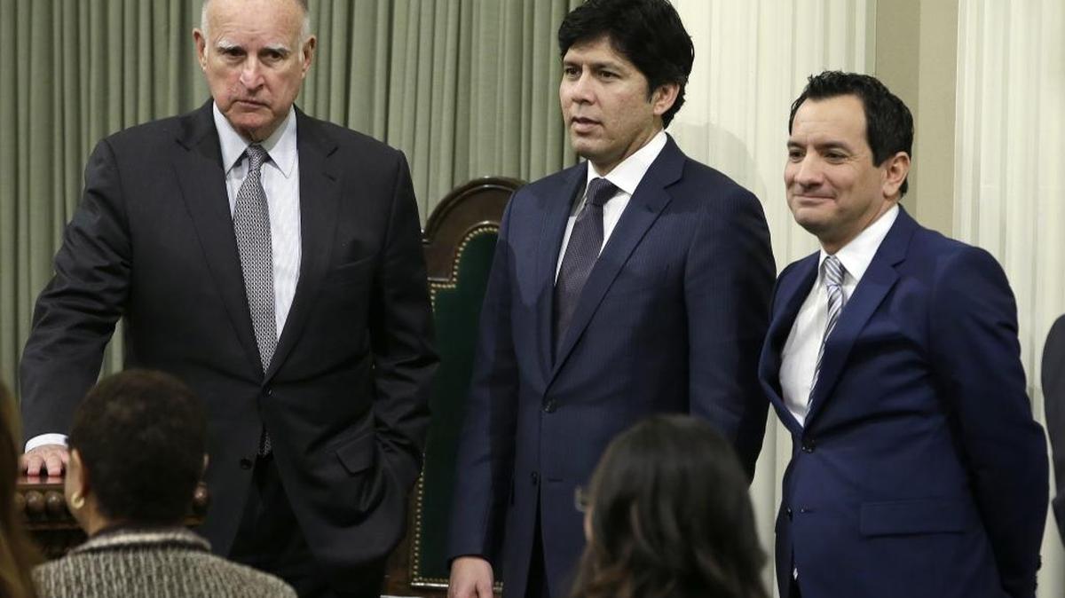 In this Monday March 7, 2016 file photo, California Gov. Jerry Brown, left, Senate President Pro Tem Kevin de Leon, D-Los Angeles, center, and Assembly Speaker Anthony Rendon, D-Paramount, are seen at the Capitol in Sacramento, Calif.