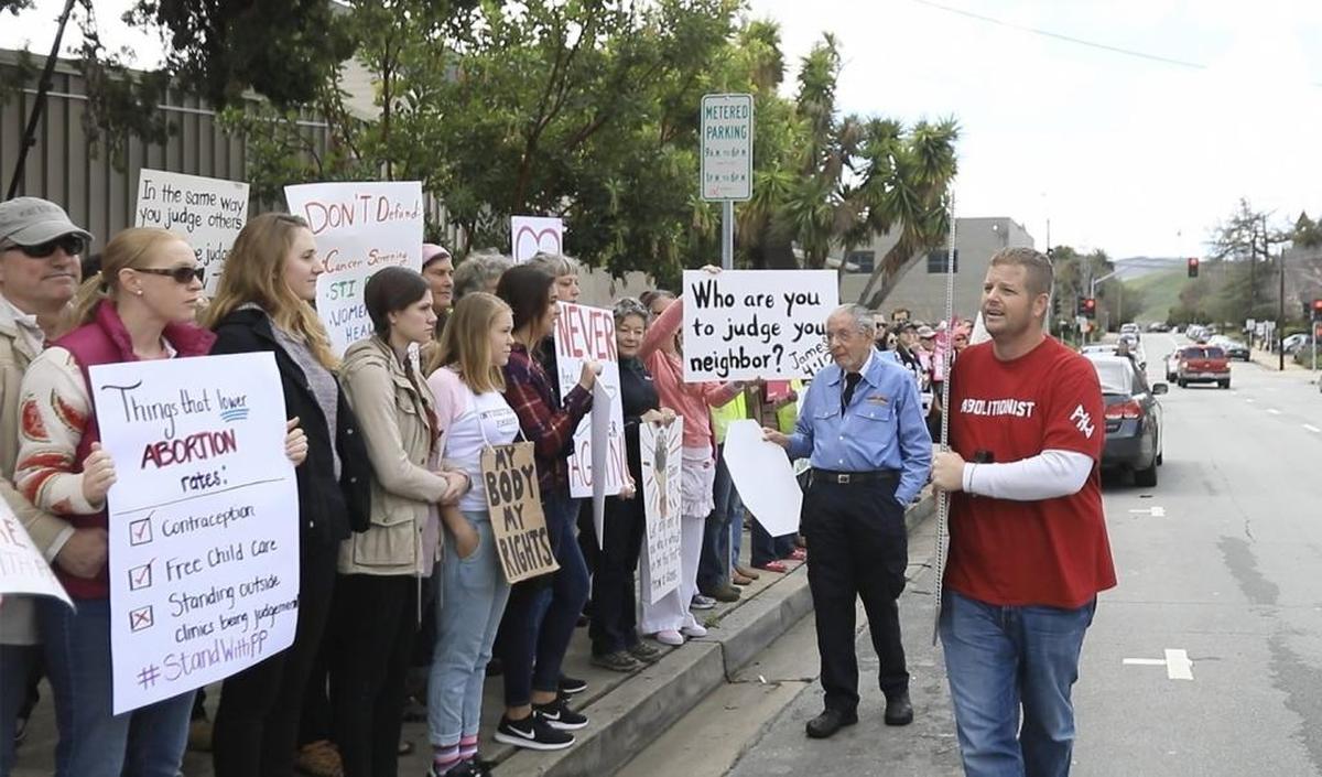 Demonstrators organized to support Planned Parenthood in San Luis Obispo, Saturday, February 11, 2017. Donny Ehinger, Paso Robles, carries a sign of an aborted fetus and yells at the supporters in front of the Planned Parenthood office in San Luis Obispo.