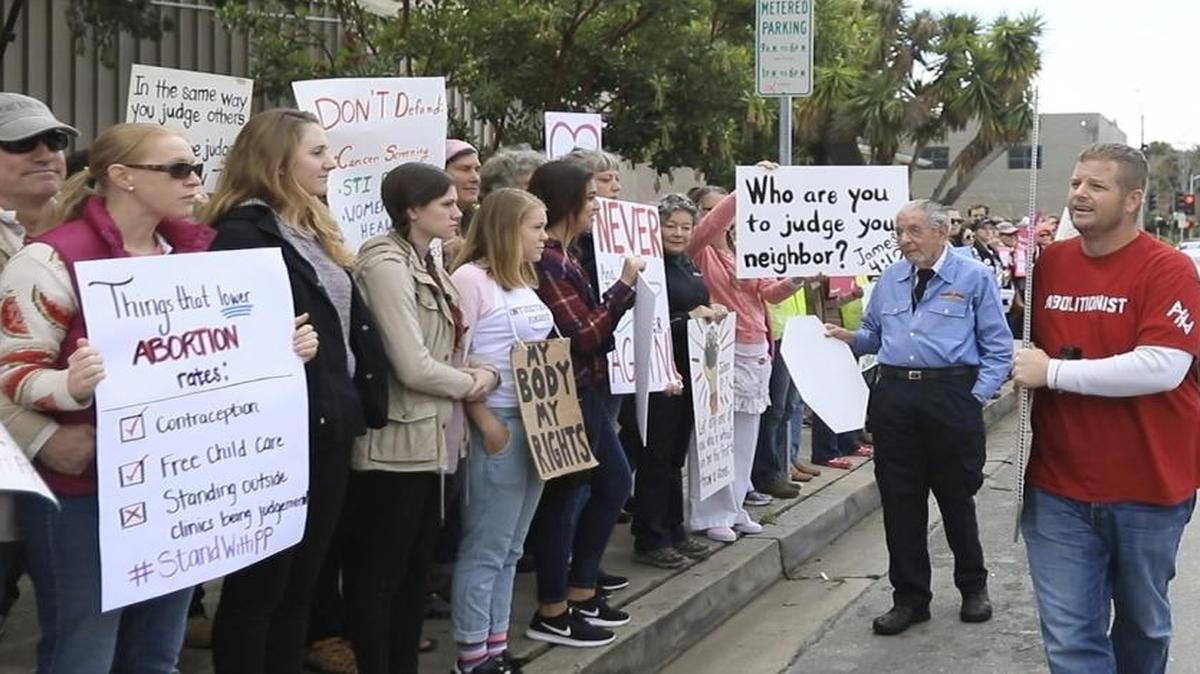 Demonstrators organized to support Planned Parenthood in San Luis Obispo, Saturday, February 11, 2017. Donny Ehinger, Paso Robles, carries a sign of an aborted fetus and yells at the supporters in front of the Planned Parenthood office in San Luis Obispo.