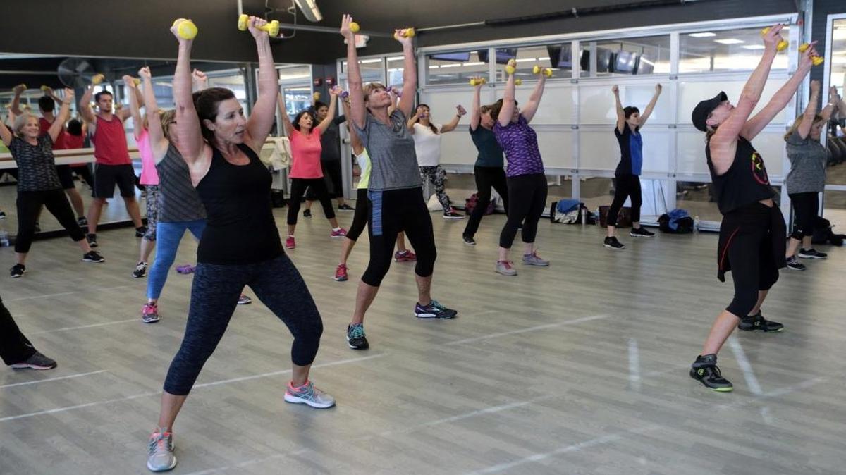 Gym members groove their way to fitness during a Zumba class on Thursday, Jan. 5, 2016, at Sequence Fitness in Panama City Beach, Fla. (