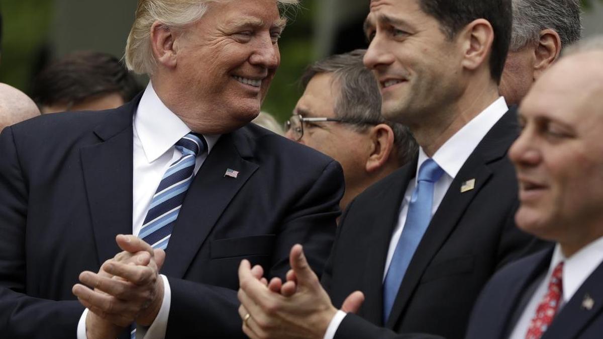 President Donald Trump talks to House Speaker Paul Ryan of Wis. in the Rose Garden of the White House in Washington, Thursday, May 4, 2017, after the House pushed through a health care bill.