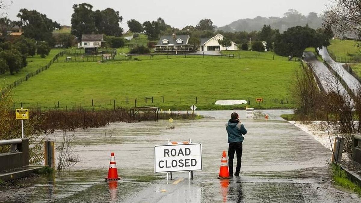 San Luis Creek flows over San Luis Bay Drive east of Highway 101 in January.