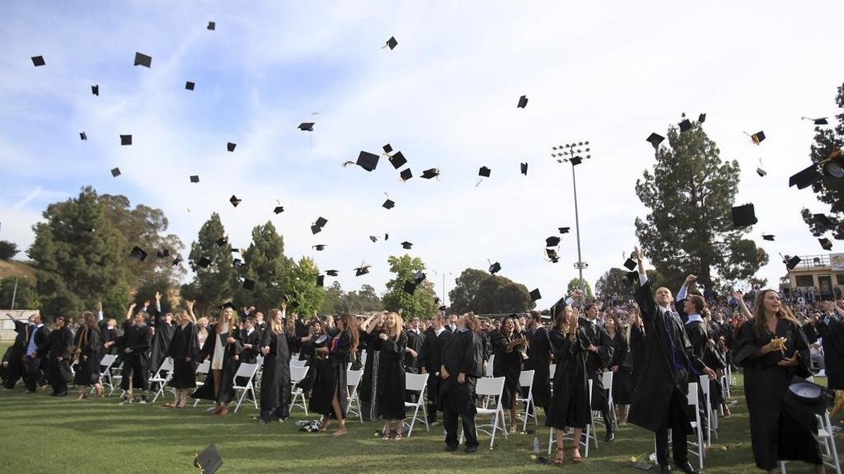 San Luis Obispo High School grads toss their caps at the end of the ceremony 2016 ceremony.