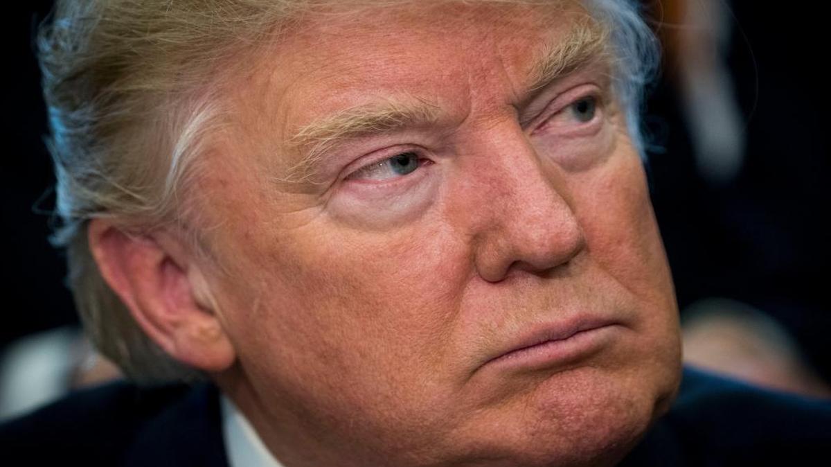 President Donald Trump listens during a meeting in the Oval Office of the White House in Washington, D.C., on March 21, 2017.