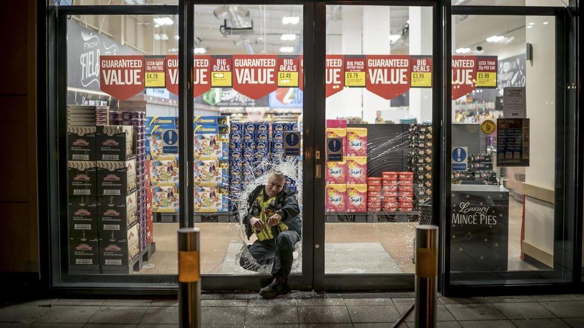 Police investigate a burglary at a supermarket in Birmingham, England, Nov. 11, 2018. Crime is rising in Britain, but Conservative-led austerity measures have led to cutbacks in police services. Police forces are shrinking, as are social services, and now officers are overwhelmed with problems that other agencies once handled. Brexit may lead the rise of the socialist Labour government.