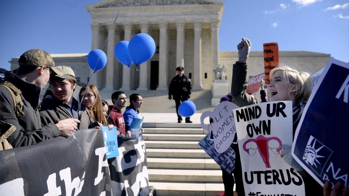 Supporters of legal access to abortion, as well as anti-abortion activists, rally outside the Supreme Court on March 2 as the Court hears oral arguments in the case of Whole Woman’s Health v. Hellerstedt, which deals with access to abortion, in Washington, D.C.