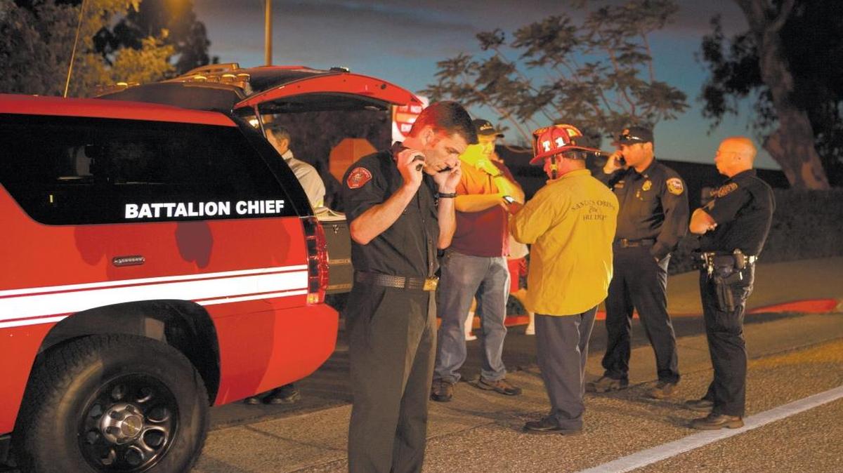 Cal Fire, San Luis Obispo City Fire and a countywide hazardous material team investigates a report of possible hazardous particulates that affected some students in the Santa Lucia dormitory in 2015. San Luis City fire Chief Garret Olson listens to his phone at the incident command vehicle.
