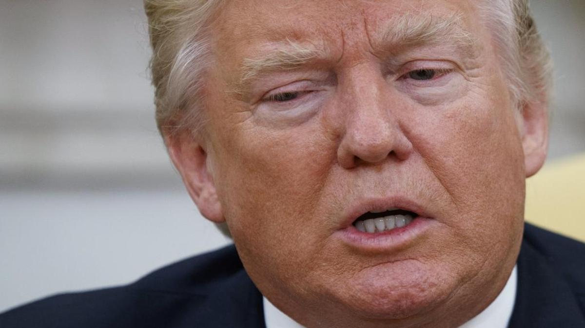 President Donald Trump talks to reporters during a meeting with Dr. Henry Kissinger, former Secretary of State and National Security Advisor under President Richard Nixon, in the Oval Office of the White House, Wednesday, May 10, 2017, in Washington.