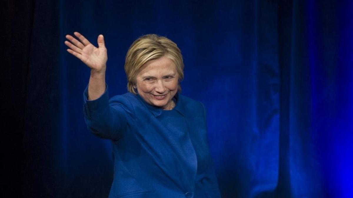 Hillary Clinton waves after addressing the Children’s Defense Fund's Beat the Odds celebration at the Newseum in Washington on Wednesday.