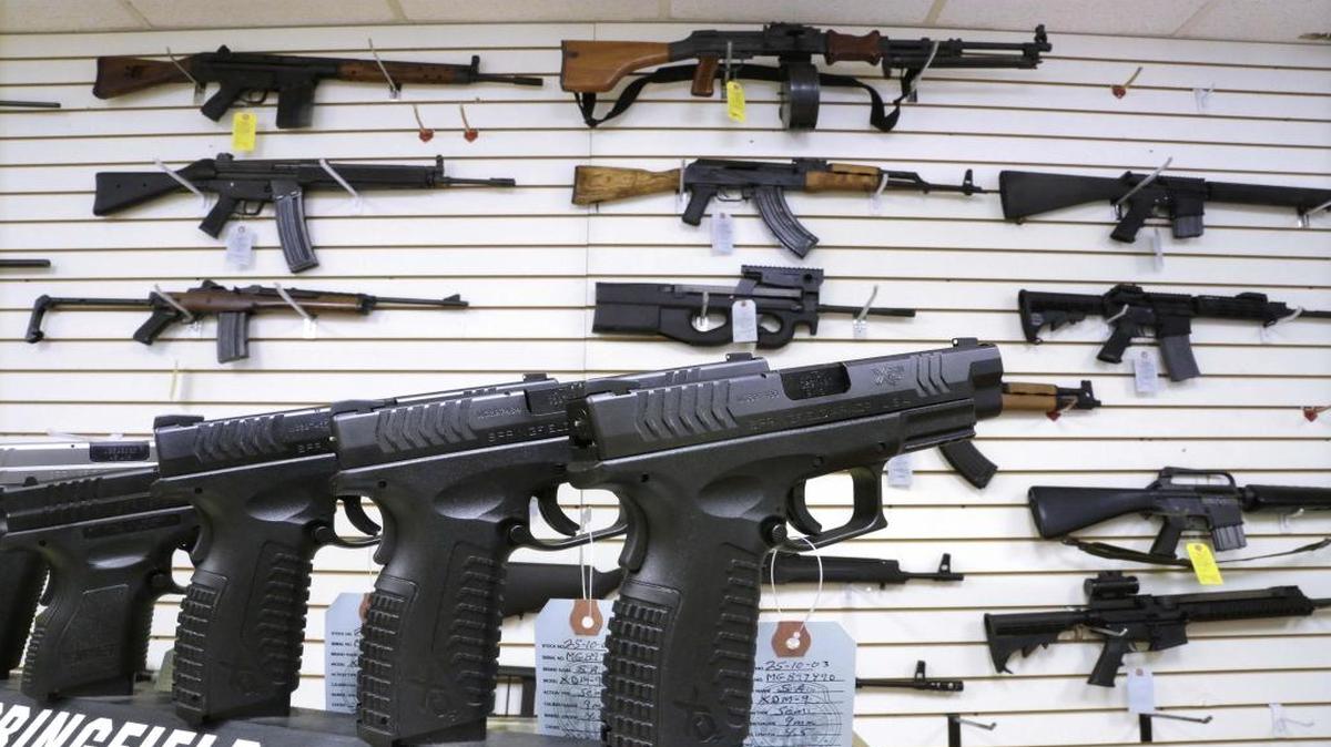 Assault weapons and handguns are seen for sale at Capitol City Arms Supply in Springfield, Ill.