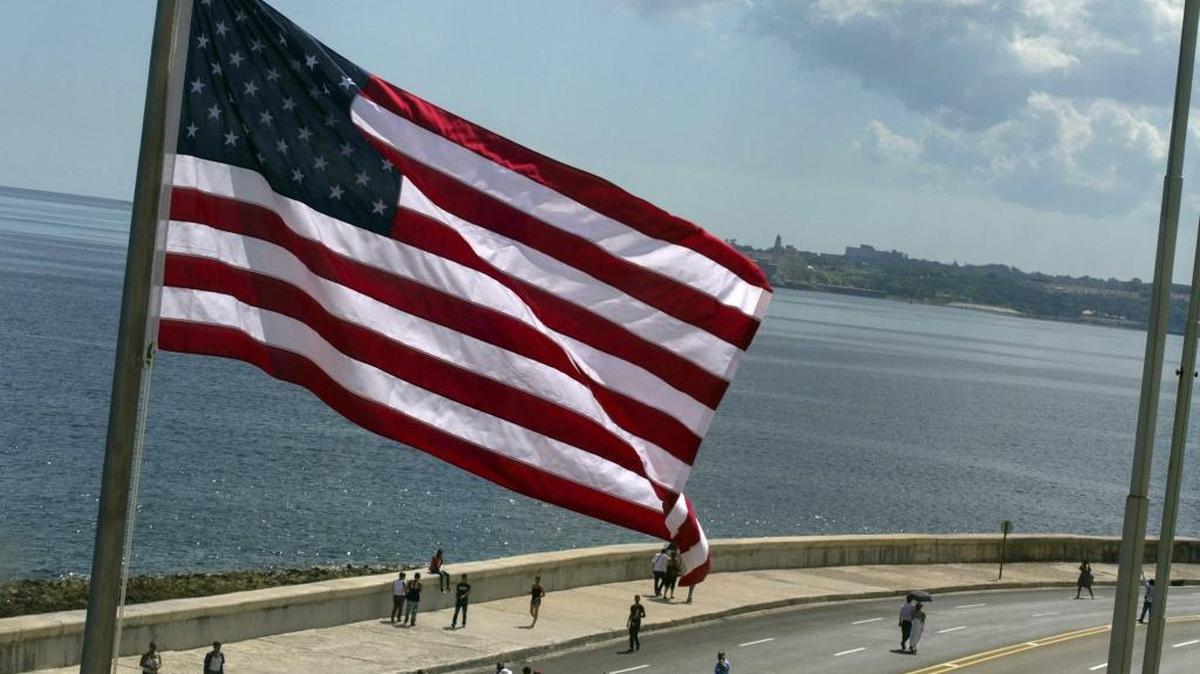 The U.S. flag waves outside the newly opened U.S. Embassy, overlooking Havana's seaside boulevard, the Malecon in Cuba, Friday, Aug. 14, 2015. The Stars and Stripes rose over the newly reopened U.S. Embassy after a half-century of often-hostile relations.