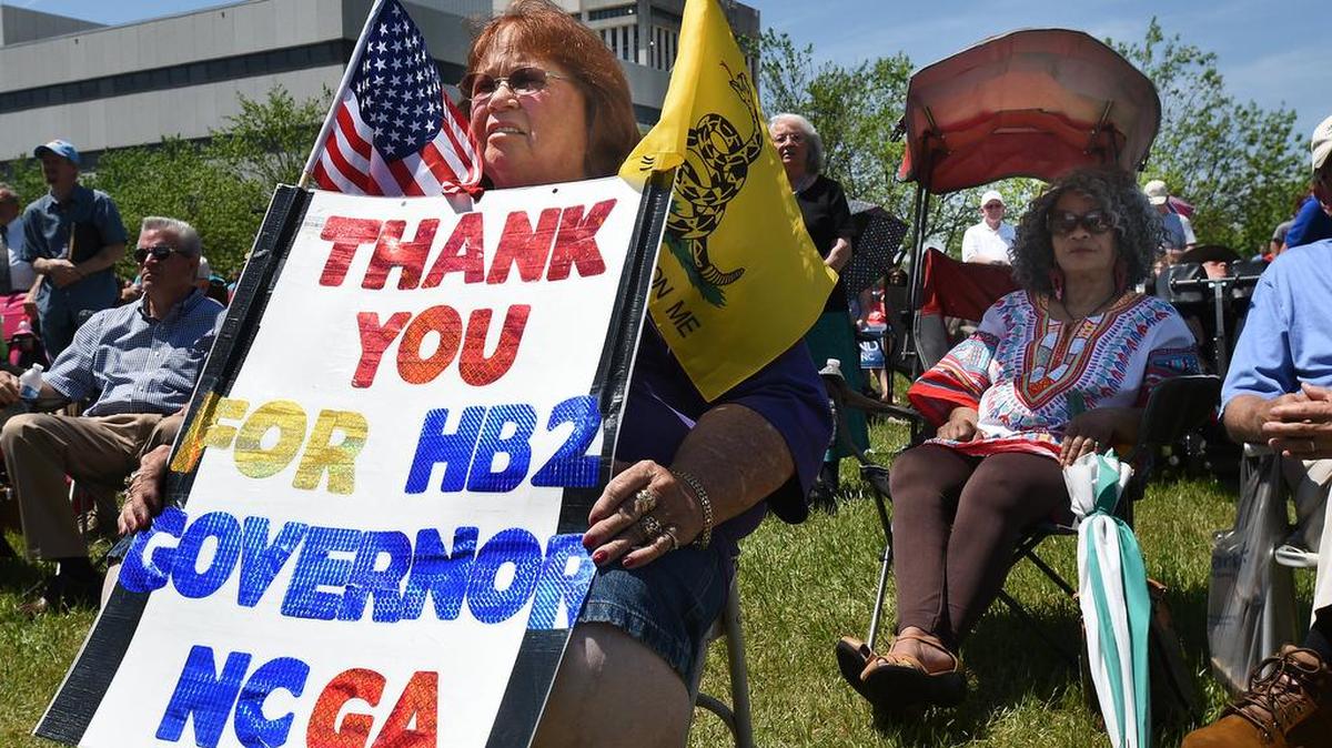 Lee Churchill of Raleigh shows her support of HB2 during a rally at the Halifax Mall in Raleigh, N.C., on Monday. While demonstrations circled North Carolina’s statehouse on Monday, for and against a Republican-backed law curtailing protections for LGBT people and limiting public bathroom access for transgender people, House Democrats filed a repeal bill that stands little chance of passing.