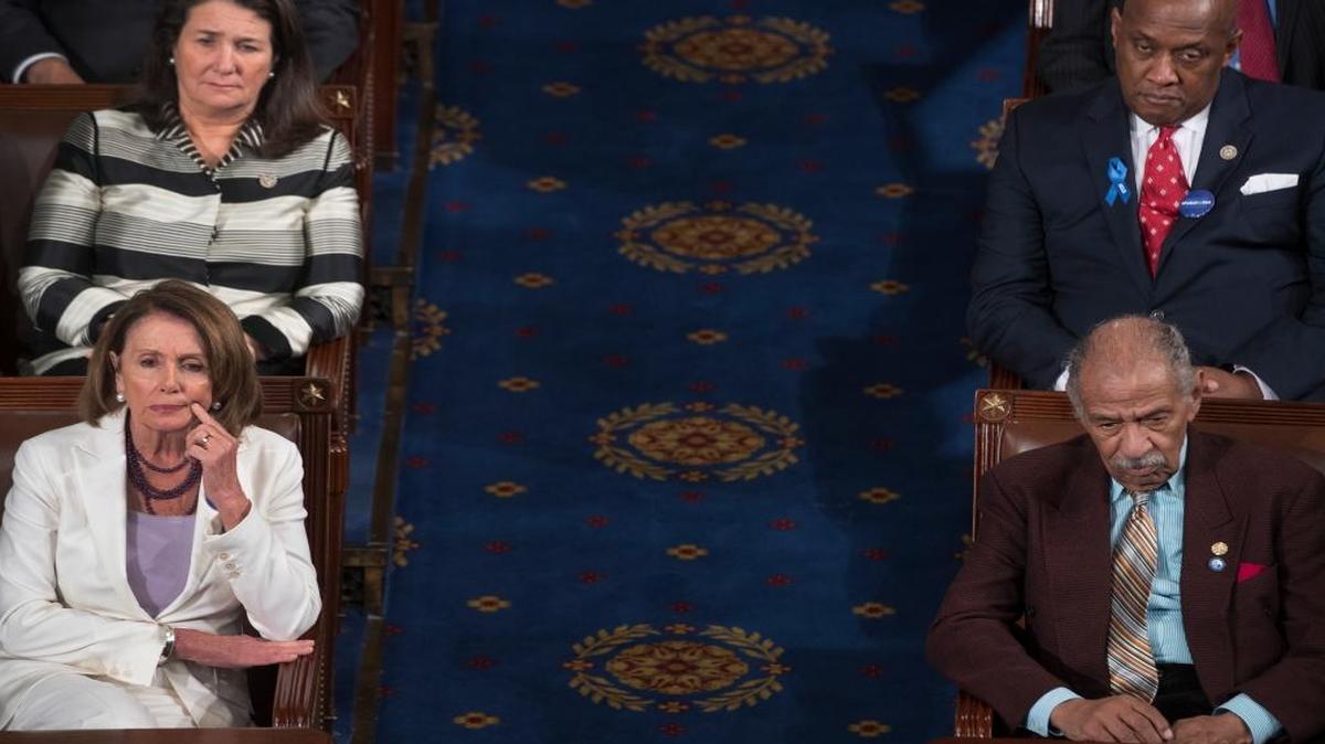 House Minority Leader Nancy Pelosi, D-Calif., and Rep. John Conyers, D-Mich., sit as President Donald Trump addresses a joint session of Congress on Capitol Hill in Washington, D.C., on Feb. 28, 2017.