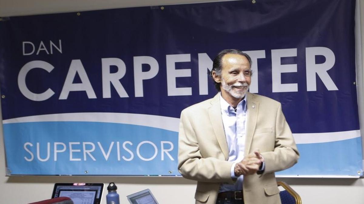 Dan Carpenter claps as election return numbers are read.