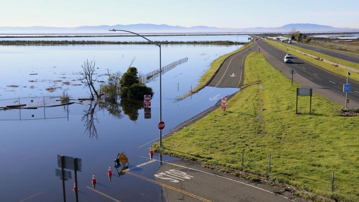 This Jan. 14, 2017 photo provided by Fraser Shilling shows flooding along Highway 37 near Vallejo, Calif. Ocean rise already is worsening the floods and high tides sweeping California this stormy winter, climate experts say, and this month’s damage and deaths highlight that even a state known as a global leader in fighting climate change has yet to tackle some of the hardest work of dealing with it.