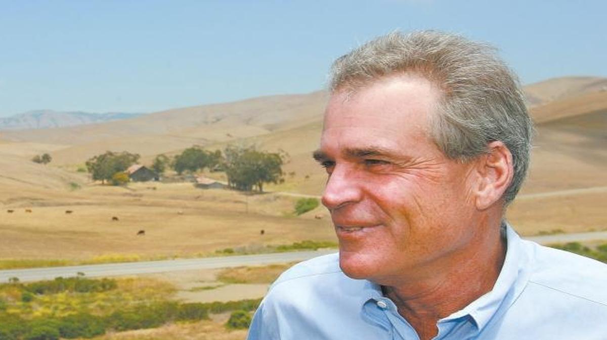 Greg Bettencourt, left, and Roger Lyon celebrate having inked a conservation easment covering the San Geronimo Ranch in 2007.