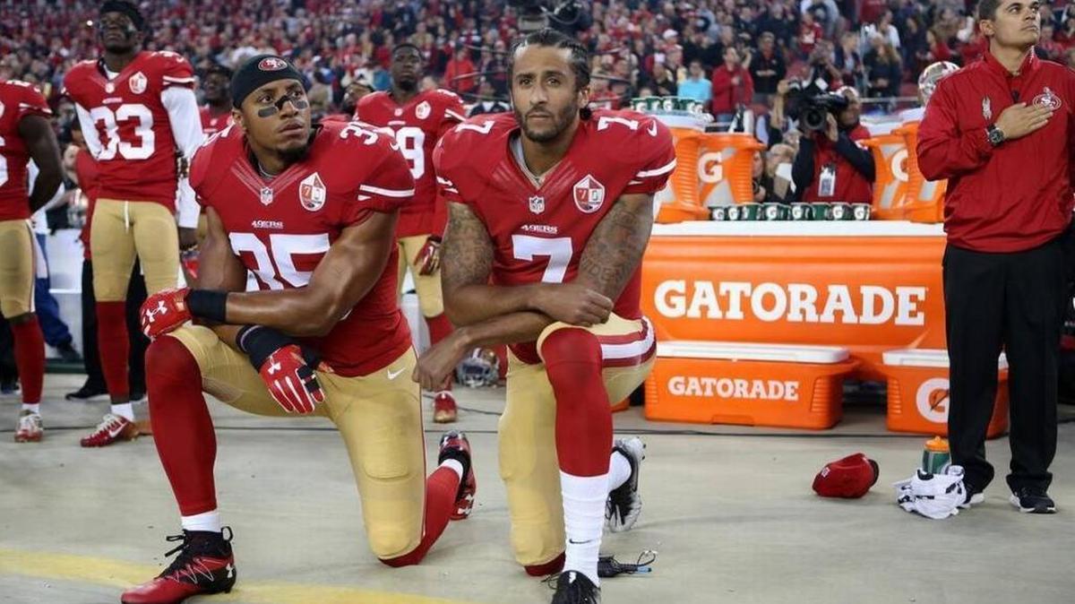 San Francisco 49ers Eric Reid (35) and Colin Kaepernick (7) take a knee during the National Anthem prior to their season opener against the Los Angeles Rams during an NFL football game Monday, Sept. 12, 2016, in Santa Clara, CA.