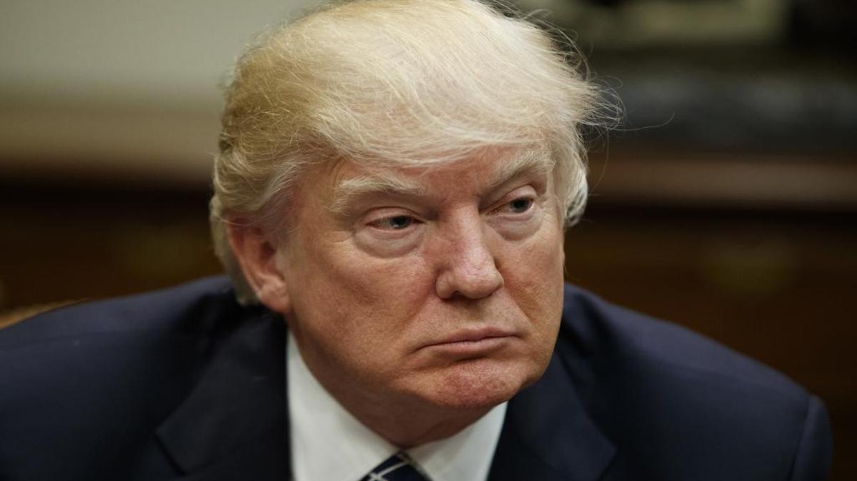 President Donald Trump listens during a meeting with the Fraternal Order of Police, Tuesday, March 28, 2017, in the Roosevelt Room of the White House in Washington.