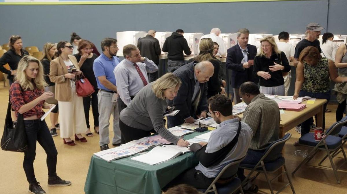 People vote at a polling place set up at the Kenter Canyon Elementary School in Los Angeles.