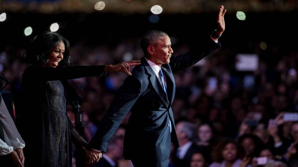 President Barack Obama and First Lady Michelle Obama wave to the audience after giving his farewell speech at McCormick Place on Jan, 10, 2017 in Chicago.