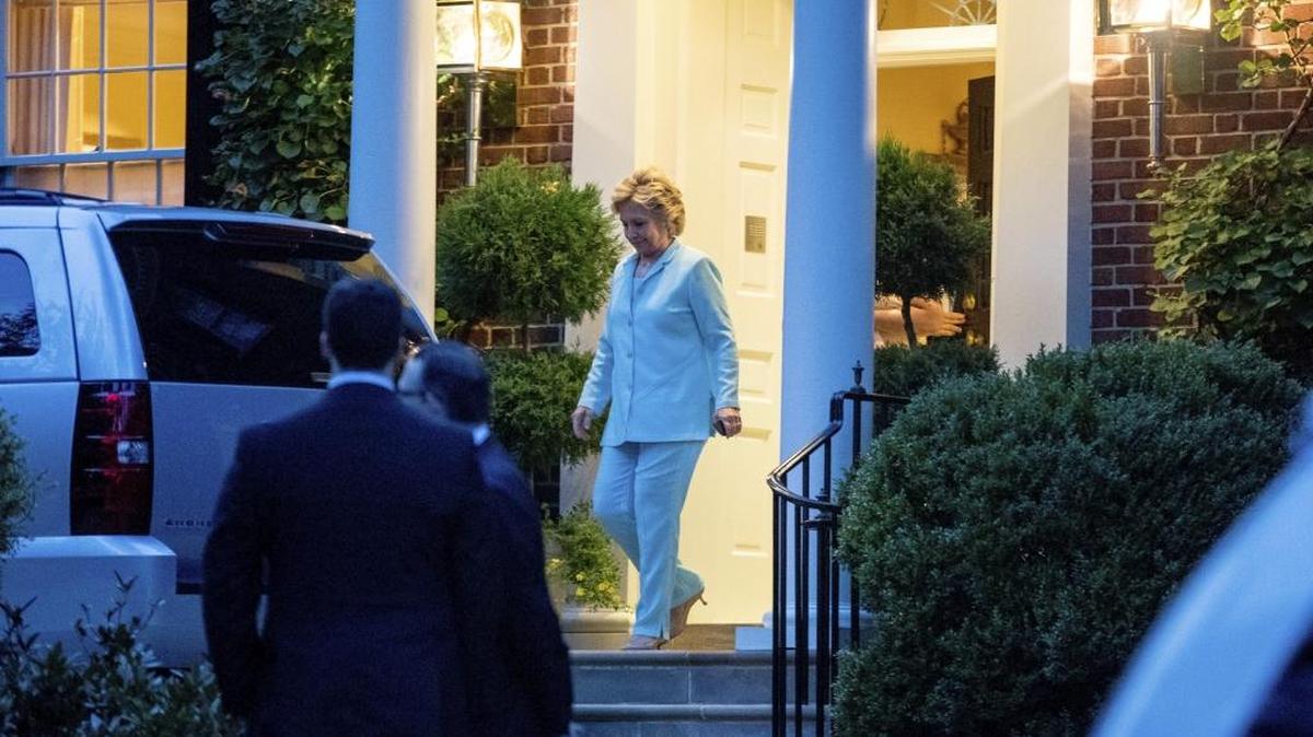 Democratic presidential candidate Hillary Clinton leaves her home in Washington, Friday, Aug. 5, 2016, after hosting a Latinos for Hillary dinner to head to Reagan National Airport to travel to her home in New York.